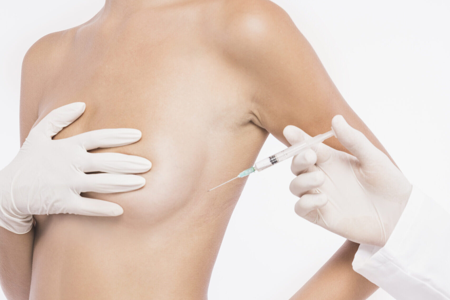 plastic-surgeon-injecting-woman-breast